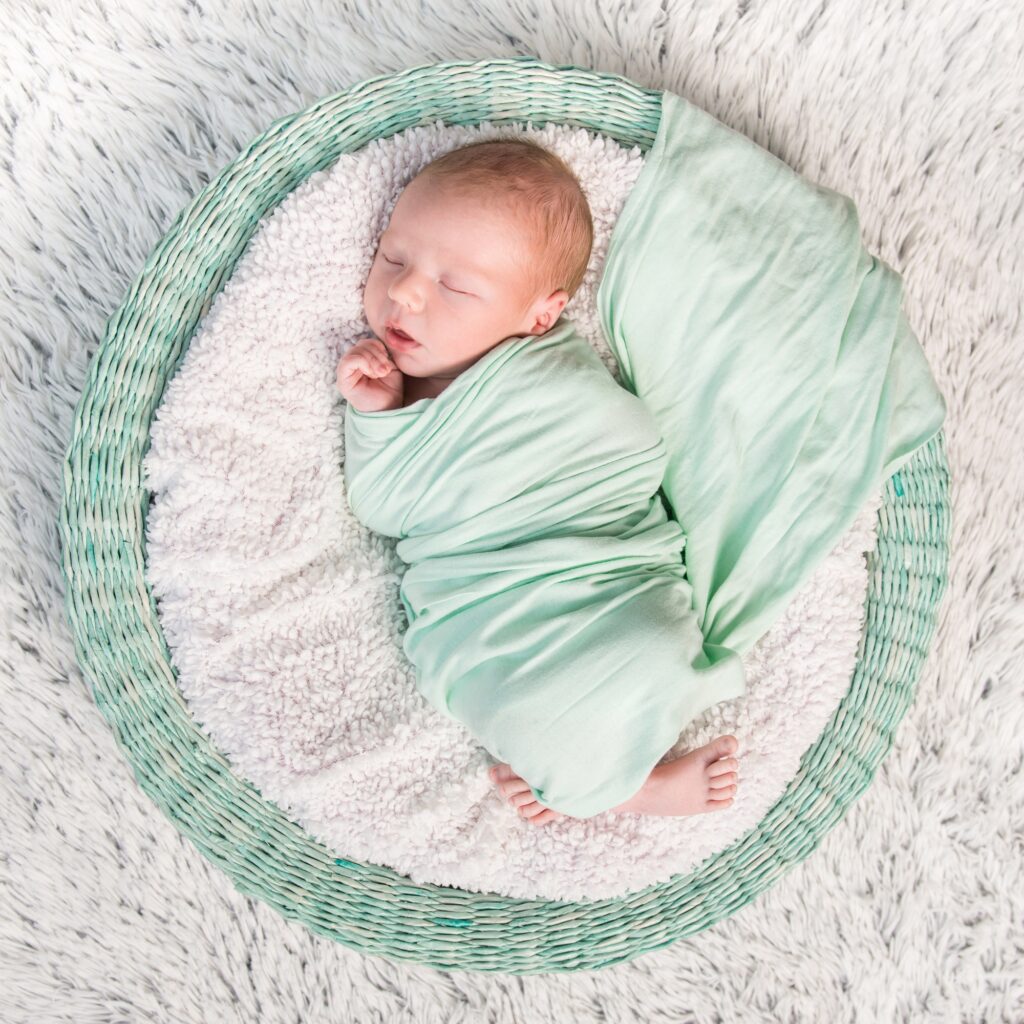 sweet newborn wrapped in a nappy sleeping