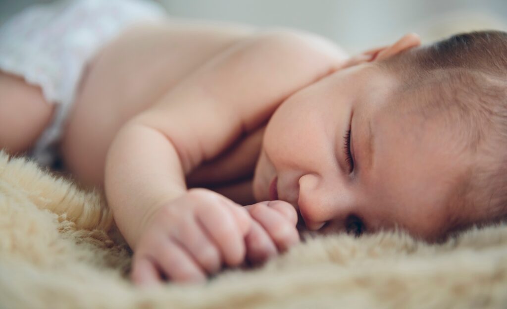 Baby sleeping on a blanket